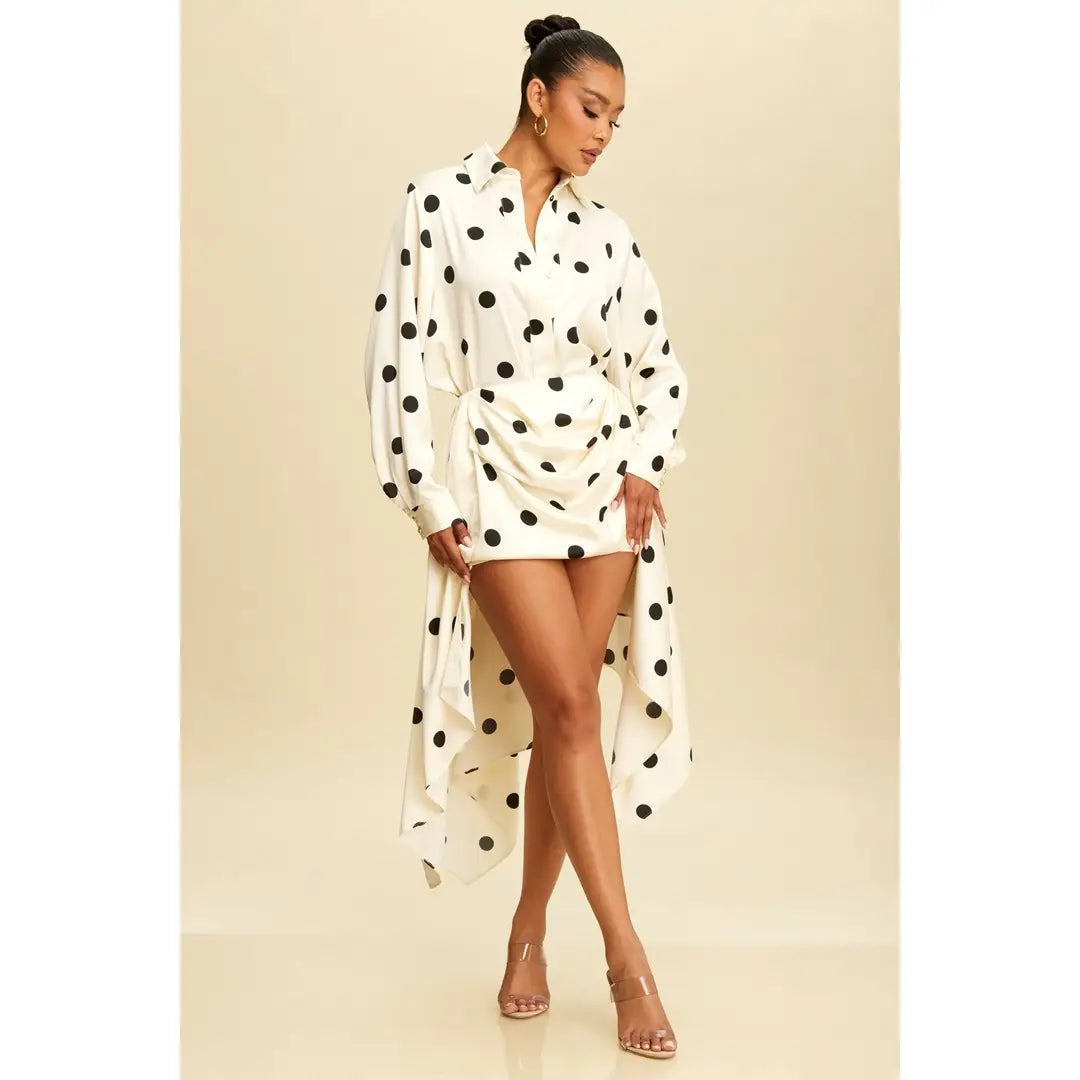 Woman wearing a black dress with white polka dots