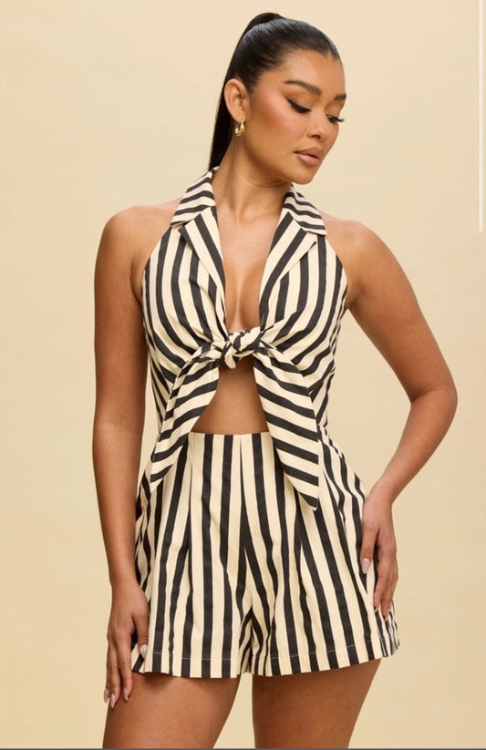 Woman wearing a black and white striped romper